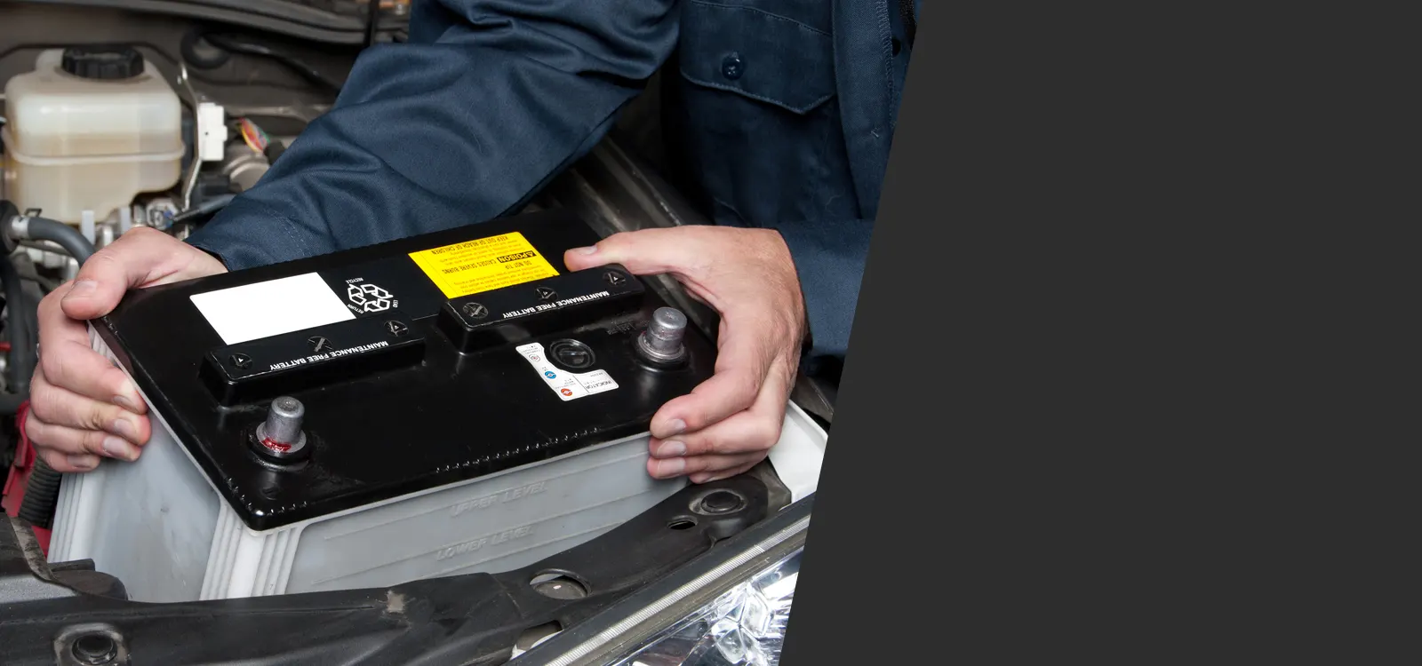Mechanic Replacing Car Battery